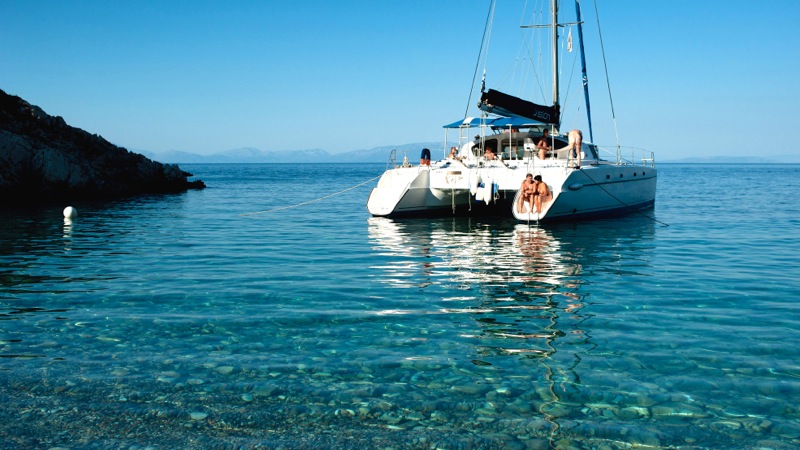 Catamaran in sea off Greek Island