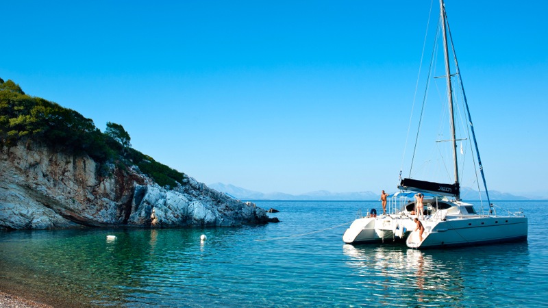 Catamaran Naturist Sailing in Greek Sea